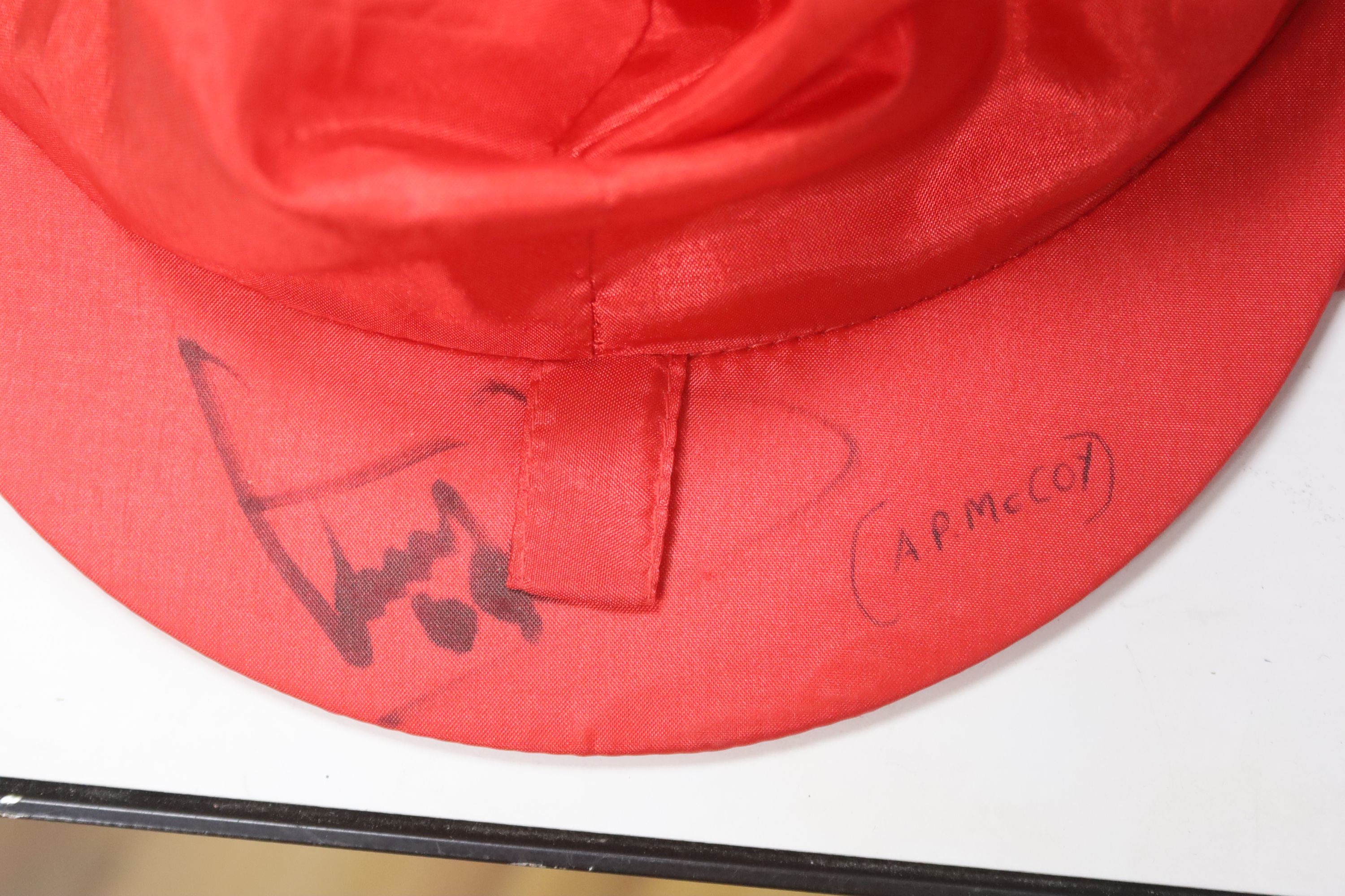 Two A.P. McCoy signed silk caps